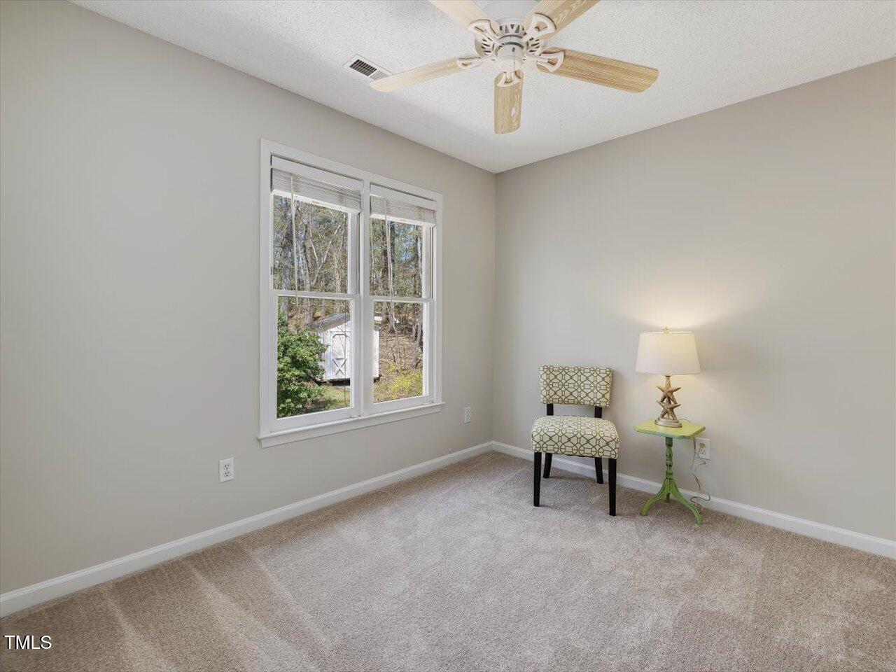 4818 Glendarion Drive Durham, NC 27713 - Photo 37 of 44 a living room with furniture and a window