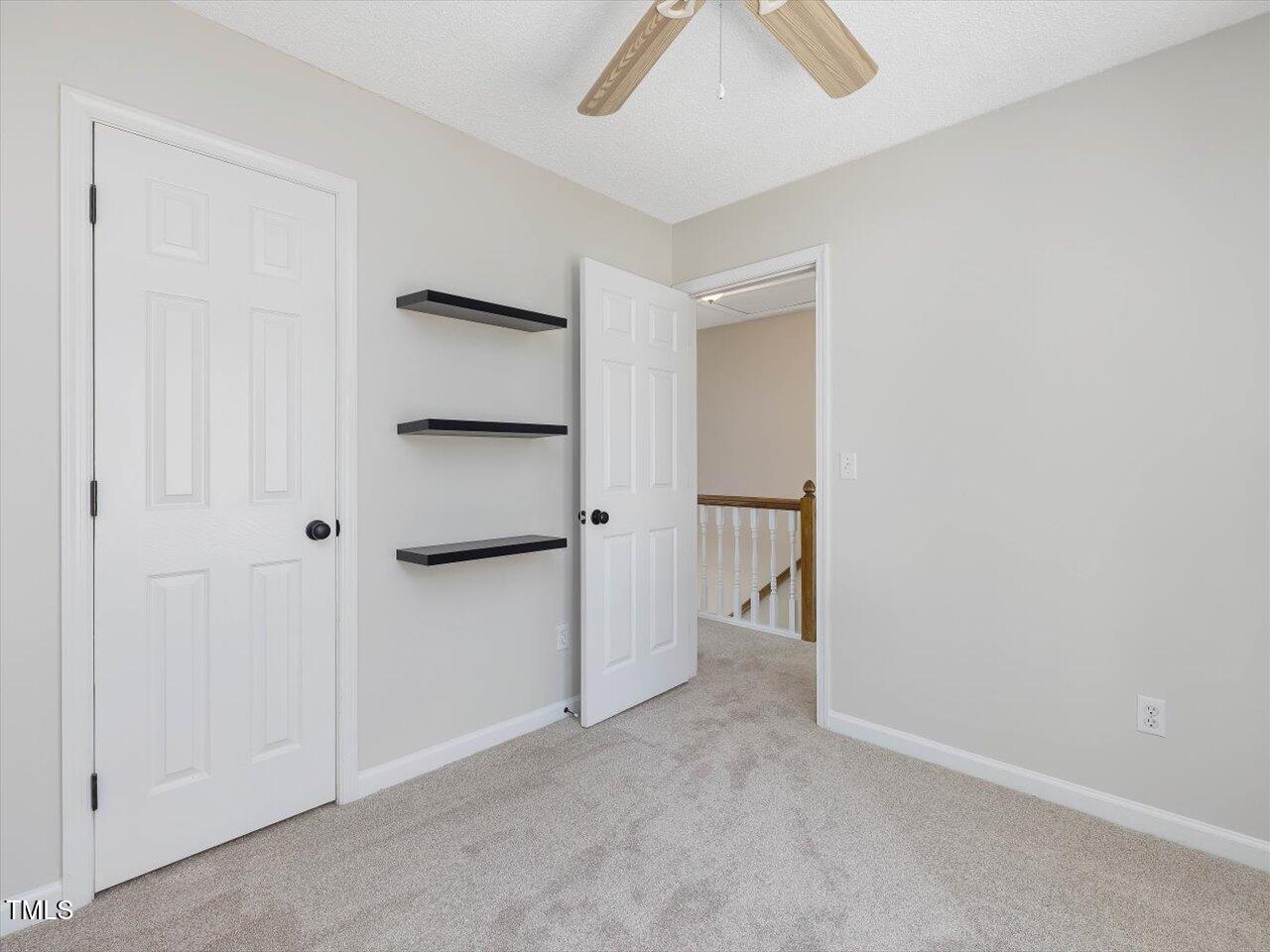4818 Glendarion Drive Durham, NC 27713 - Photo 38 of 44 an empty room with closet area