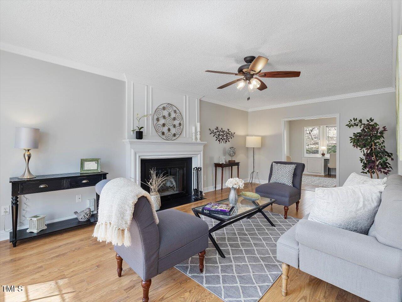 4818 Glendarion Drive Durham, NC 27713 - Photo 6 of 44 a living room with furniture and a fireplace
