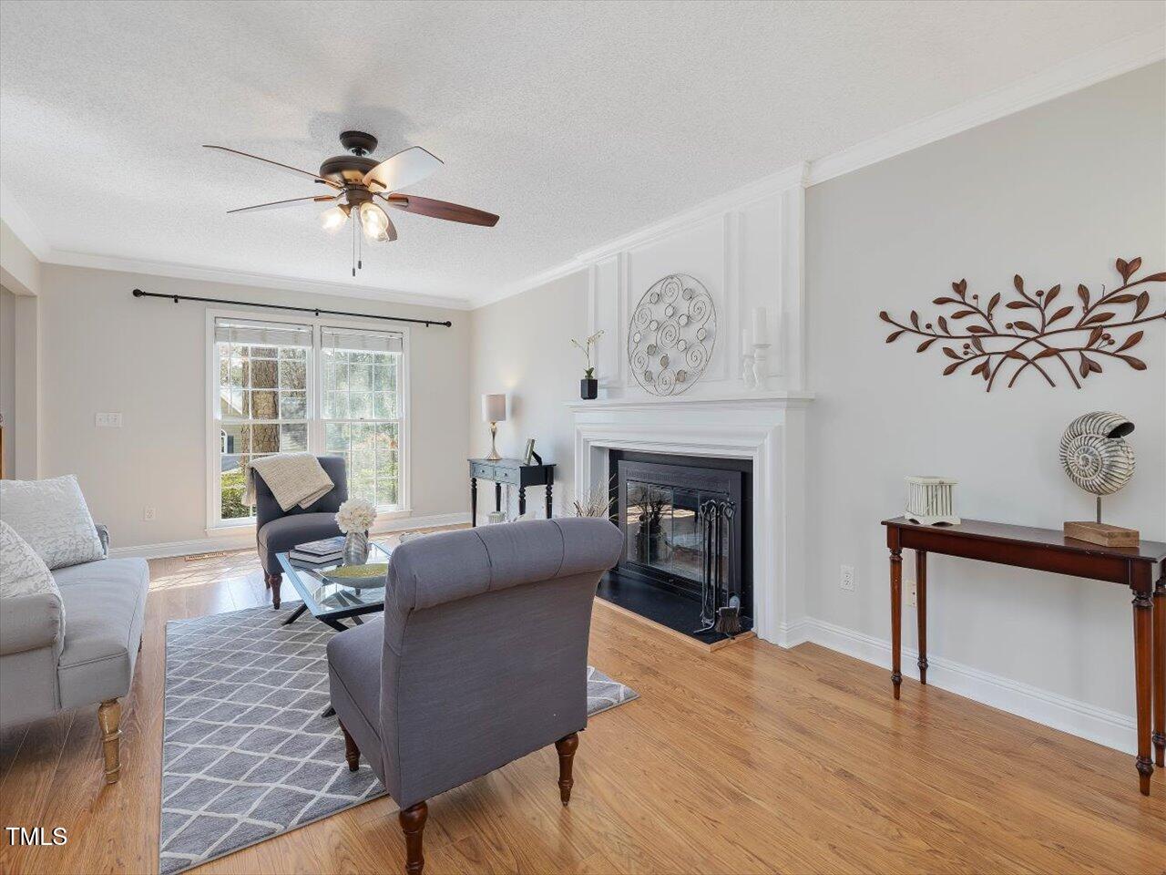 4818 Glendarion Drive Durham, NC 27713 - Photo 7 of 44 a living room with furniture and a fireplace