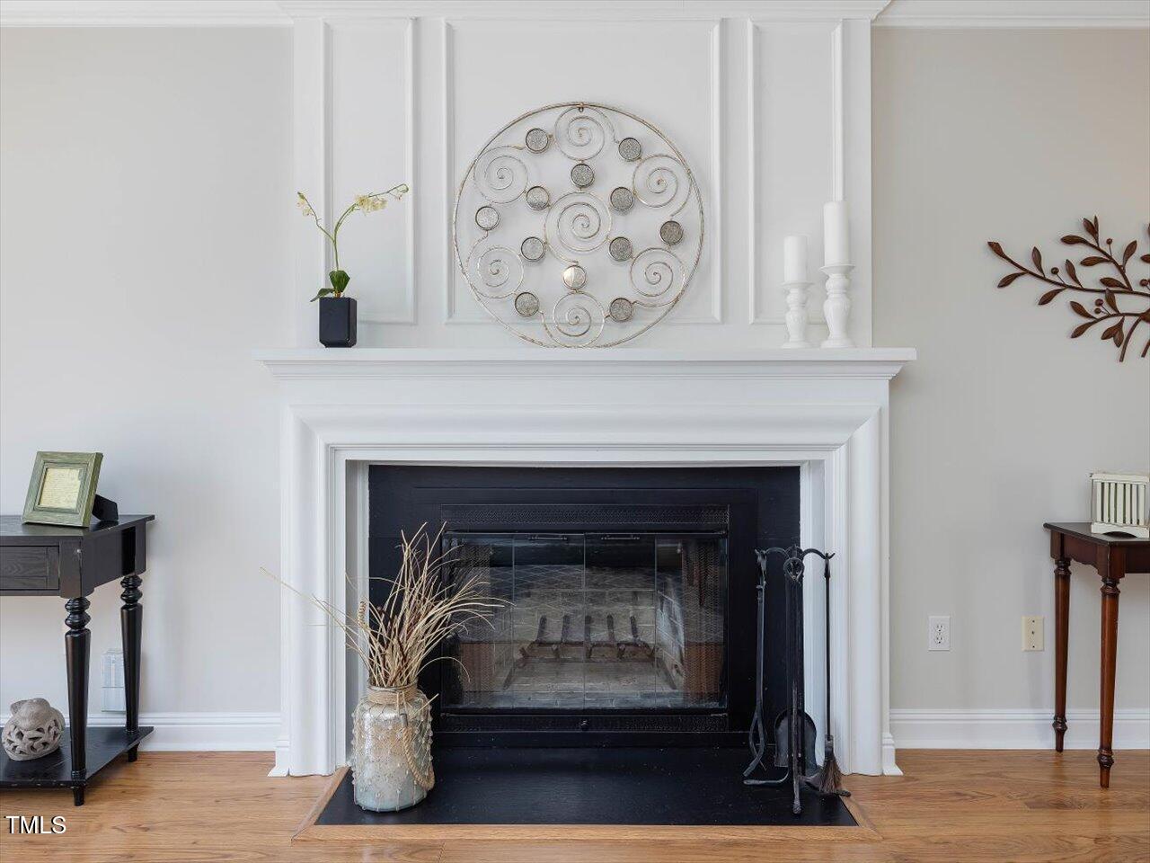 4818 Glendarion Drive Durham, NC 27713 - Photo 8 of 44 a living room with a fireplace with wooden floor