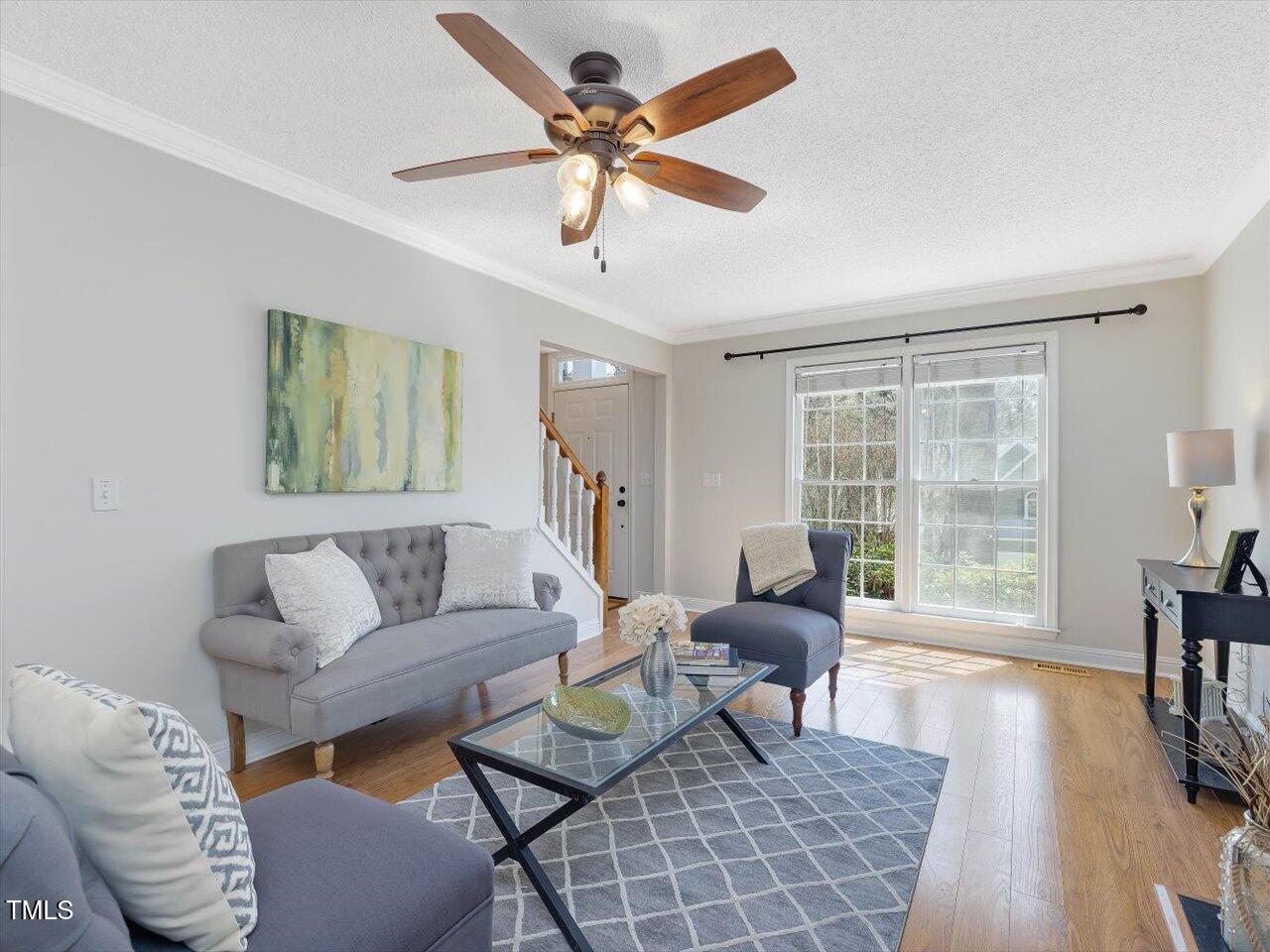 4818 Glendarion Drive Durham, NC 27713 - Photo 9 of 44 a living room with furniture and a large window