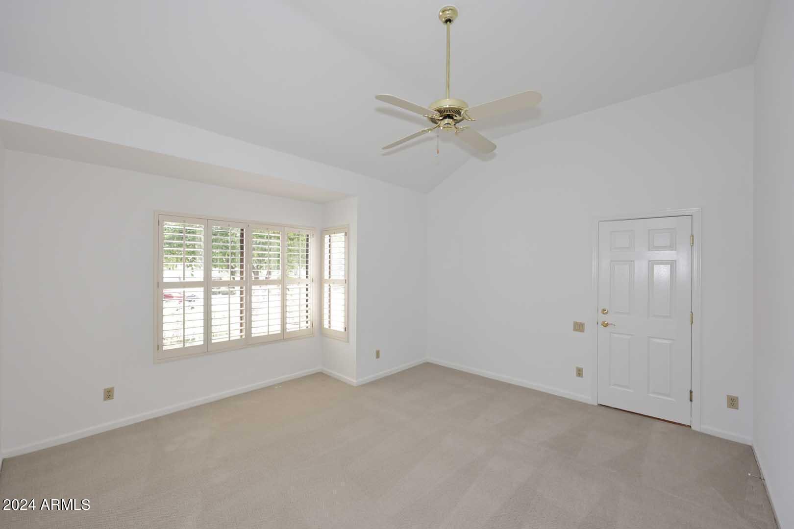 7272 East Gainey Ranch Road, Unit 55 Scottsdale, AZ 85258 - Photo 19 of 35 a view of an empty room with a window