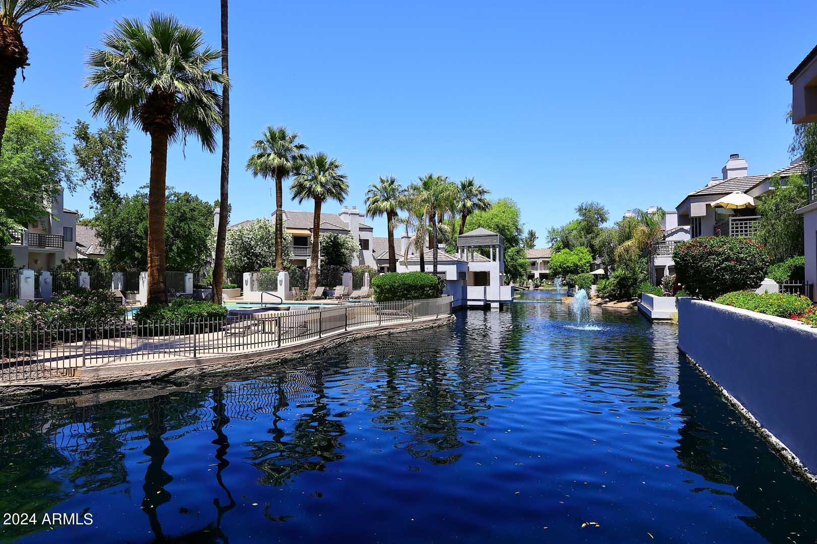 7272 East Gainey Ranch Road, Unit 55 Scottsdale, AZ 85258 - Photo 33 of 35 a swimming pool view with a outdoor space