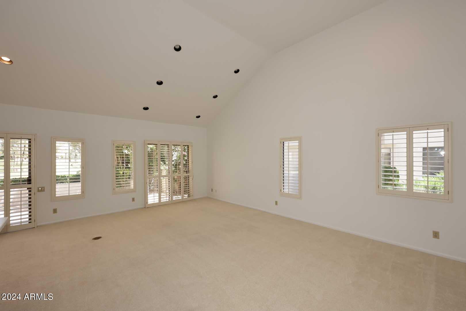 7272 East Gainey Ranch Road, Unit 55 Scottsdale, AZ 85258 - Photo 6 of 35 a view of an empty room with a window