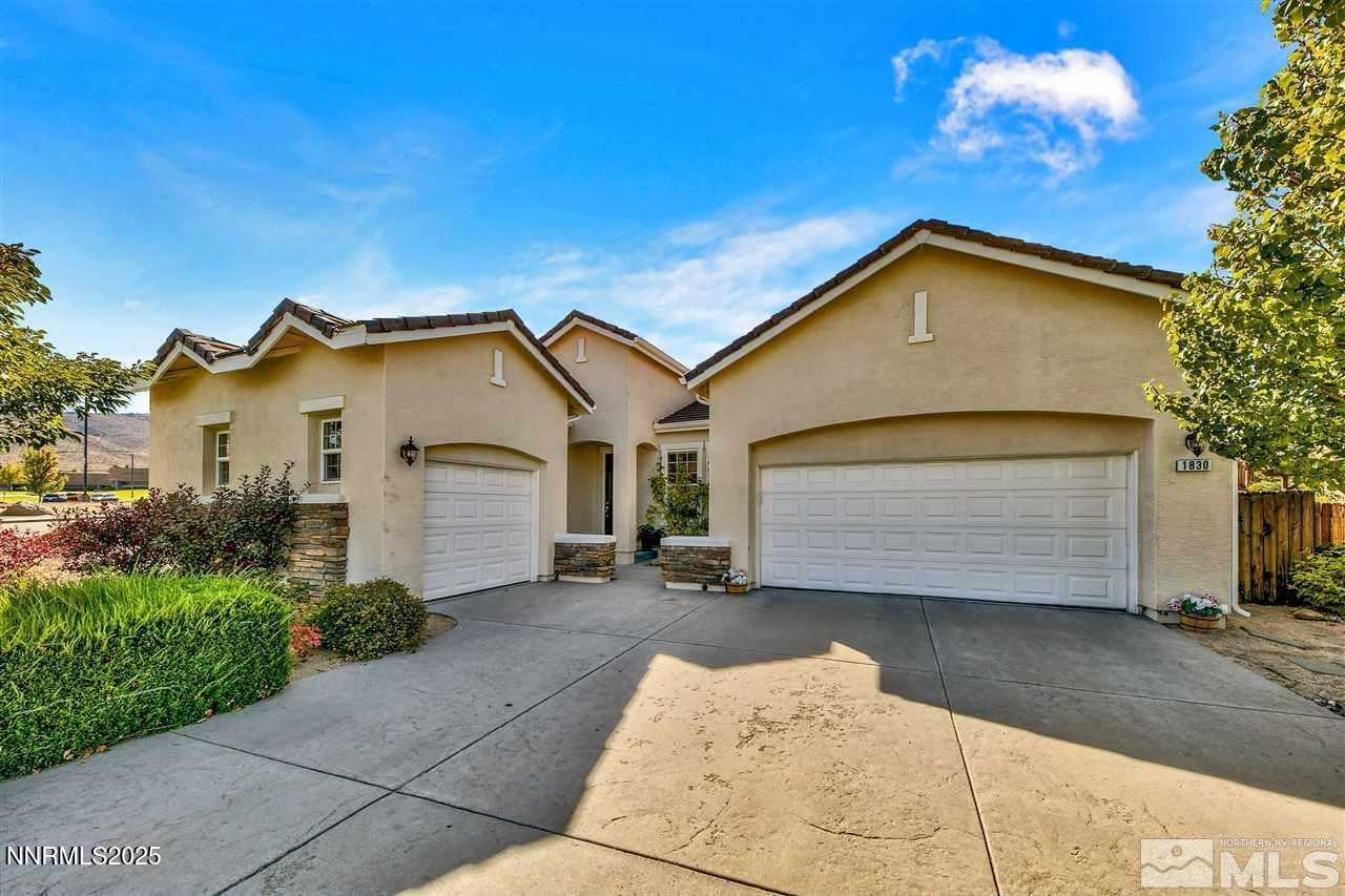 1830 Kodiak Circle Reno, NV 89511 - Photo 15 of 27 a view of a house with a yard and garage