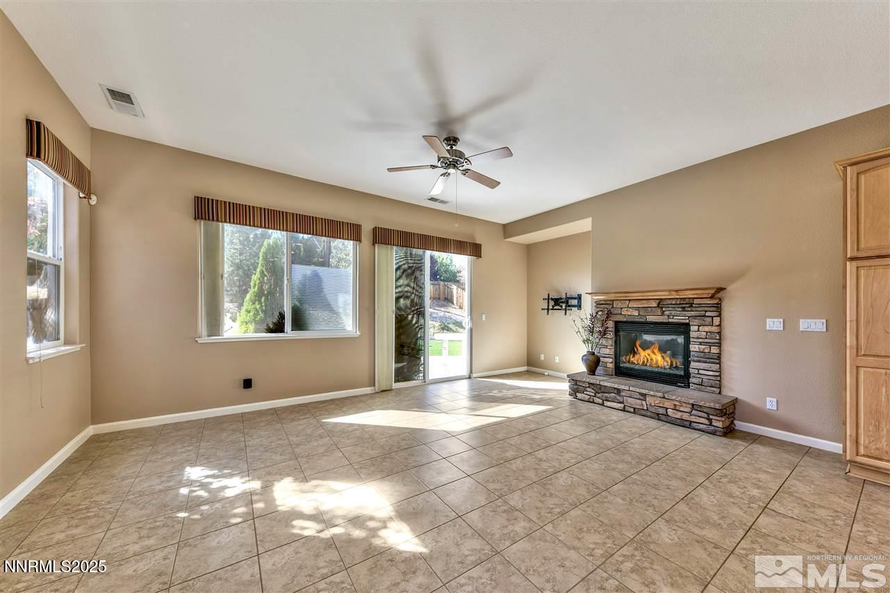 1830 Kodiak Circle Reno, NV 89511 - Photo 7 of 27 a view of a livingroom with a fireplace and window