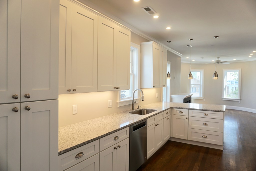 a view of a kitchen with cabinets