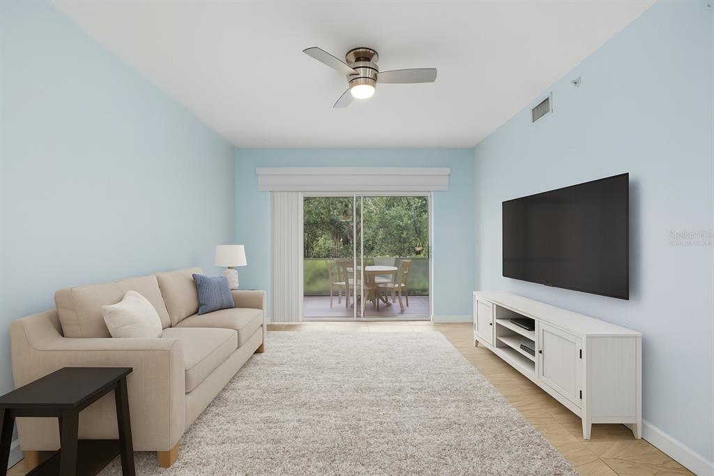 6401 Aragon Way, Unit 103 Fort Myers, FL 33966 - Photo 13 of 40 a living room with furniture and a flat screen tv