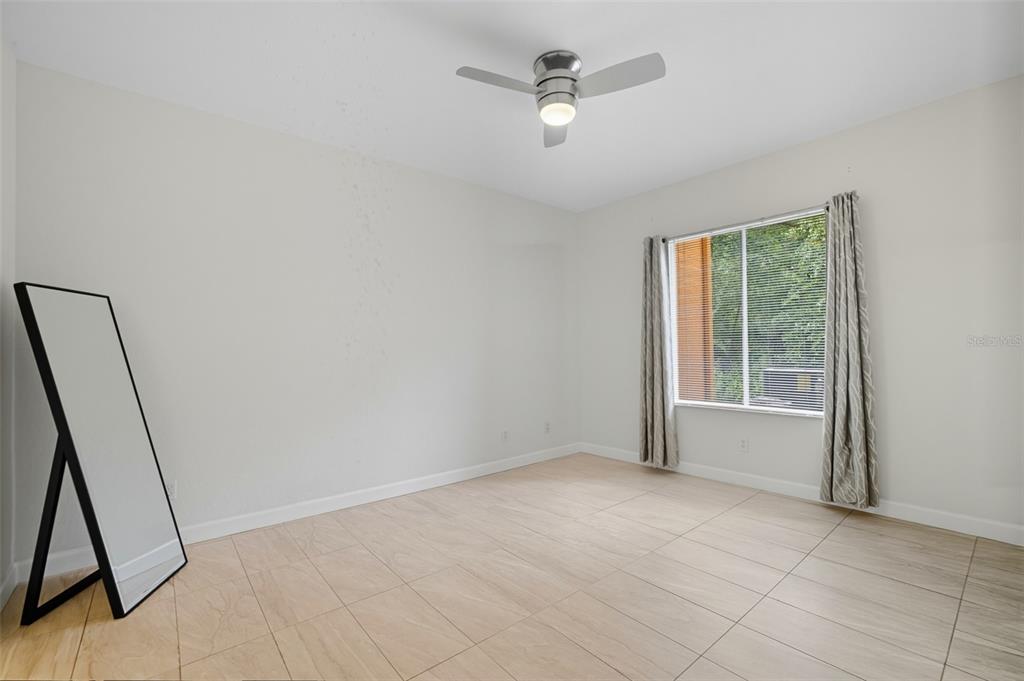 6401 Aragon Way, Unit 103 Fort Myers, FL 33966 - Photo 18 of 40 a view of an empty room with a window