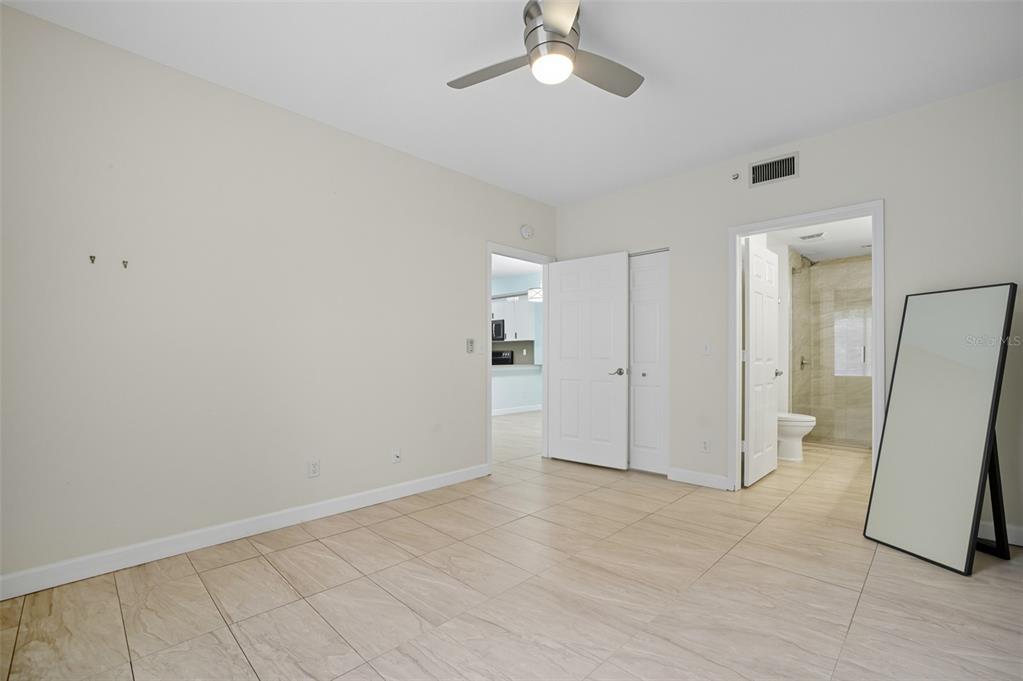 6401 Aragon Way, Unit 103 Fort Myers, FL 33966 - Photo 19 of 40 wooden floor in an empty room