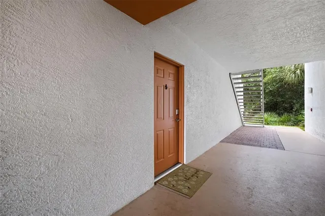 a view of a house with backyard porch and sitting area