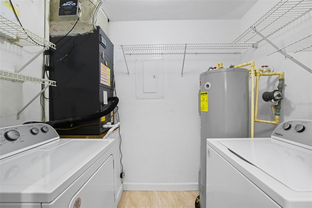 6401 Aragon Way, Unit 103 Fort Myers, FL 33966 - Photo 31 of 40 a utility room with dryer and washer