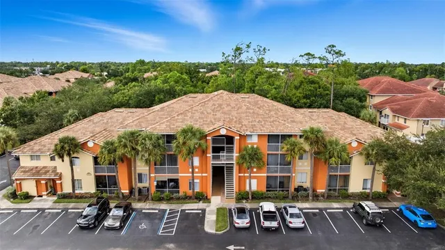 an aerial view of houses with yard