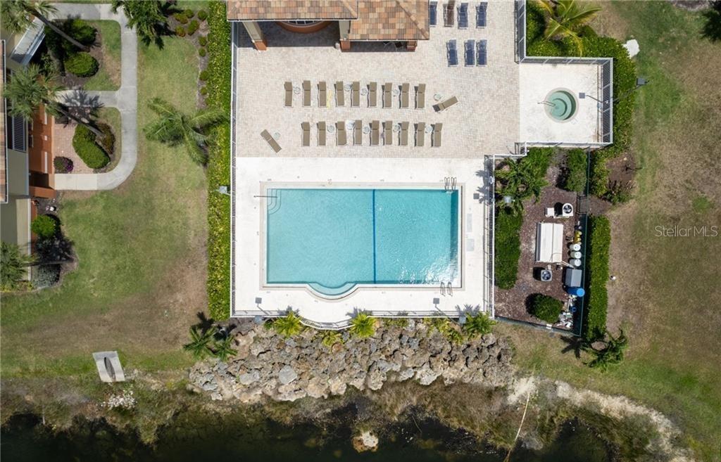 6401 Aragon Way, Unit 103 Fort Myers, FL 33966 - Photo 37 of 40 a front view of a house with a yard