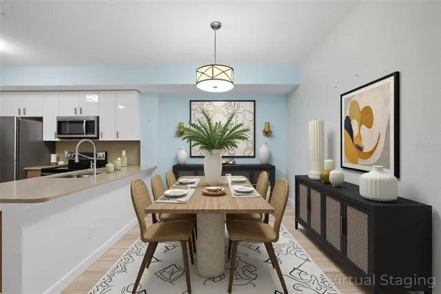 a view of a kitchen with a sink a refrigerator freezer and a dishwasher