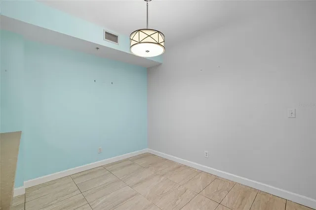 a view of a kitchen with a sink and windows