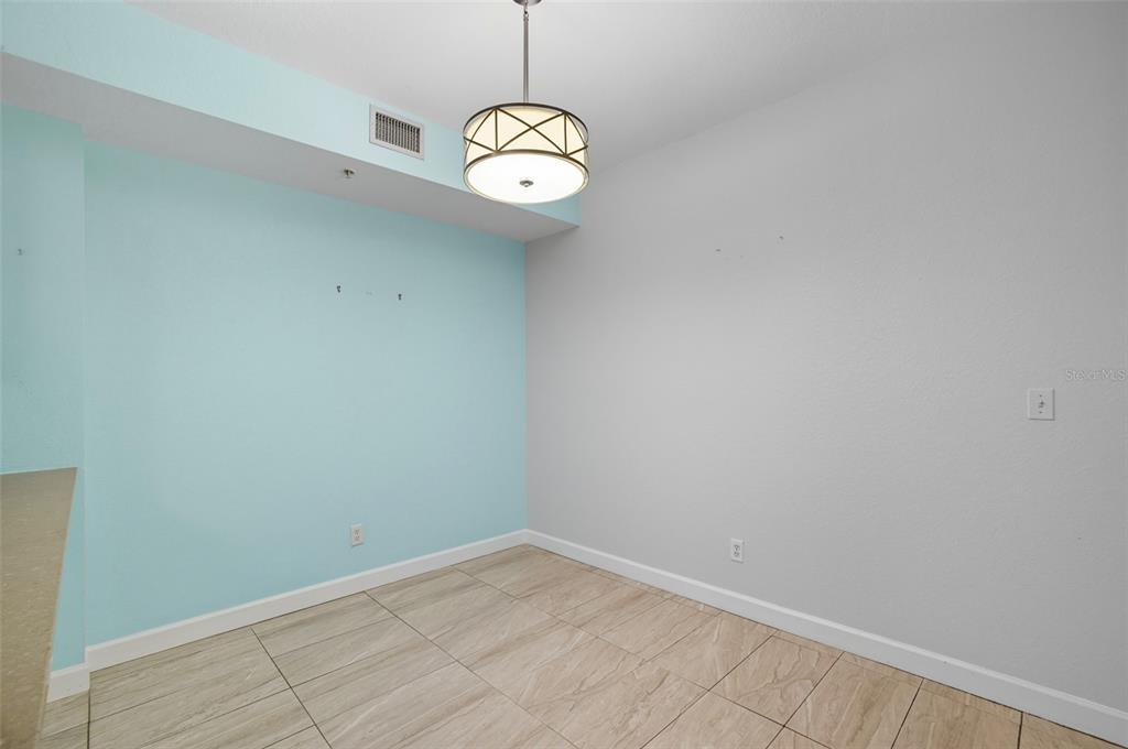 6401 Aragon Way, Unit 103 Fort Myers, FL 33966 - Photo 8 of 40 a view of a room with racks on the wall