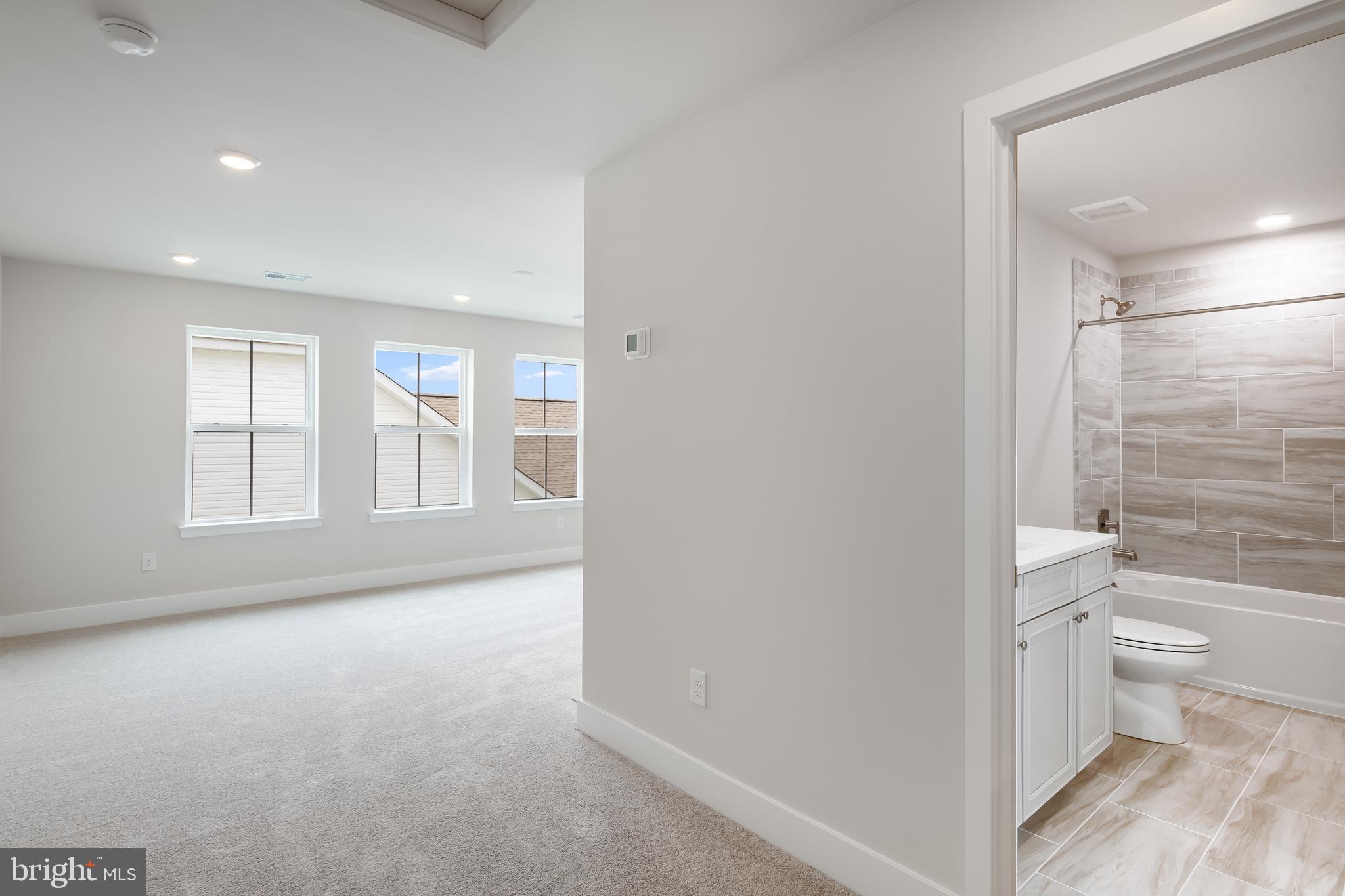 207 Mariners Circle Milton, DE 19968 - Photo 22 of 42 a bathroom with a toilet tub and a shower