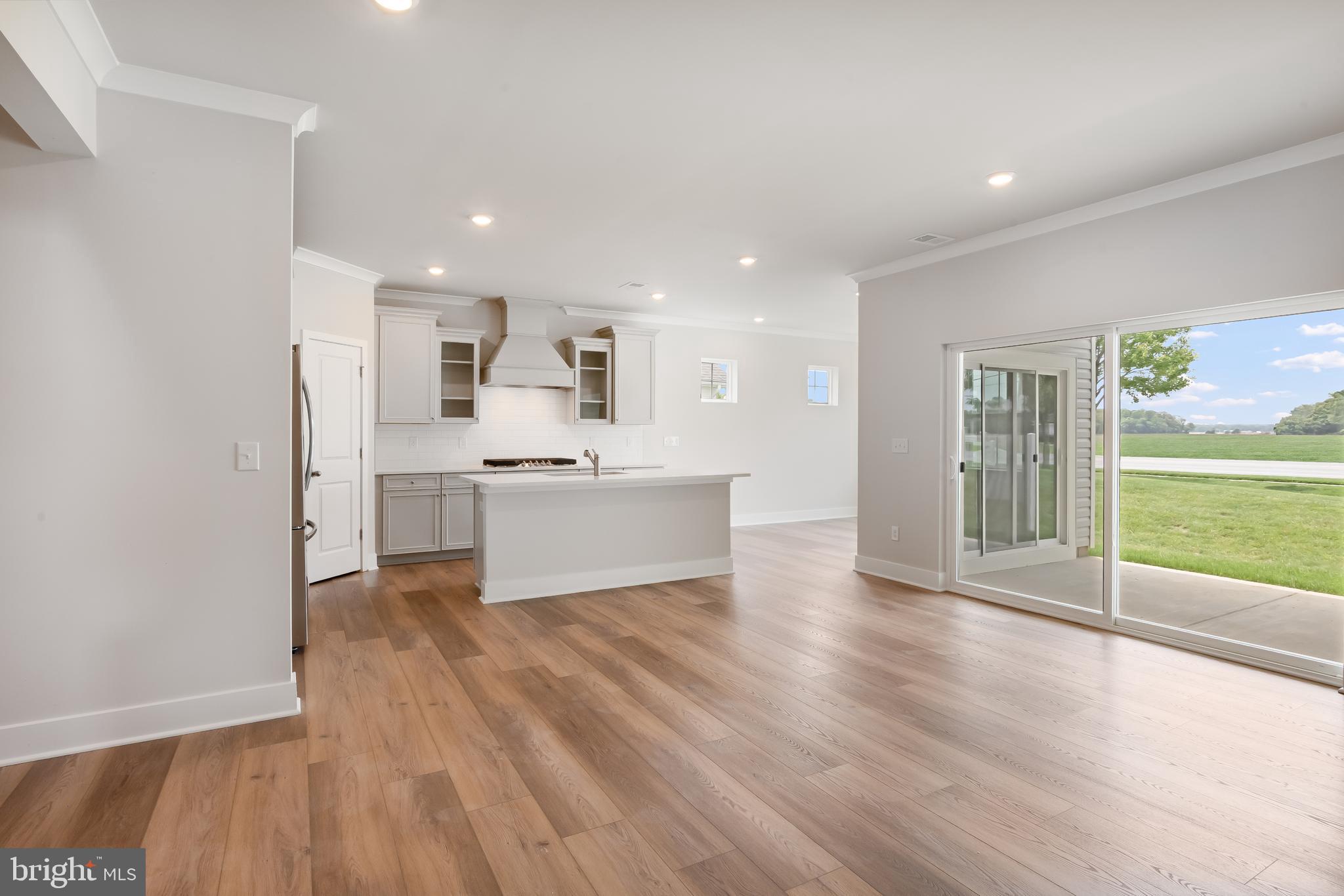 207 Mariners Circle Milton, DE 19968 - Photo 8 of 42 a view of kitchen with wooden floor