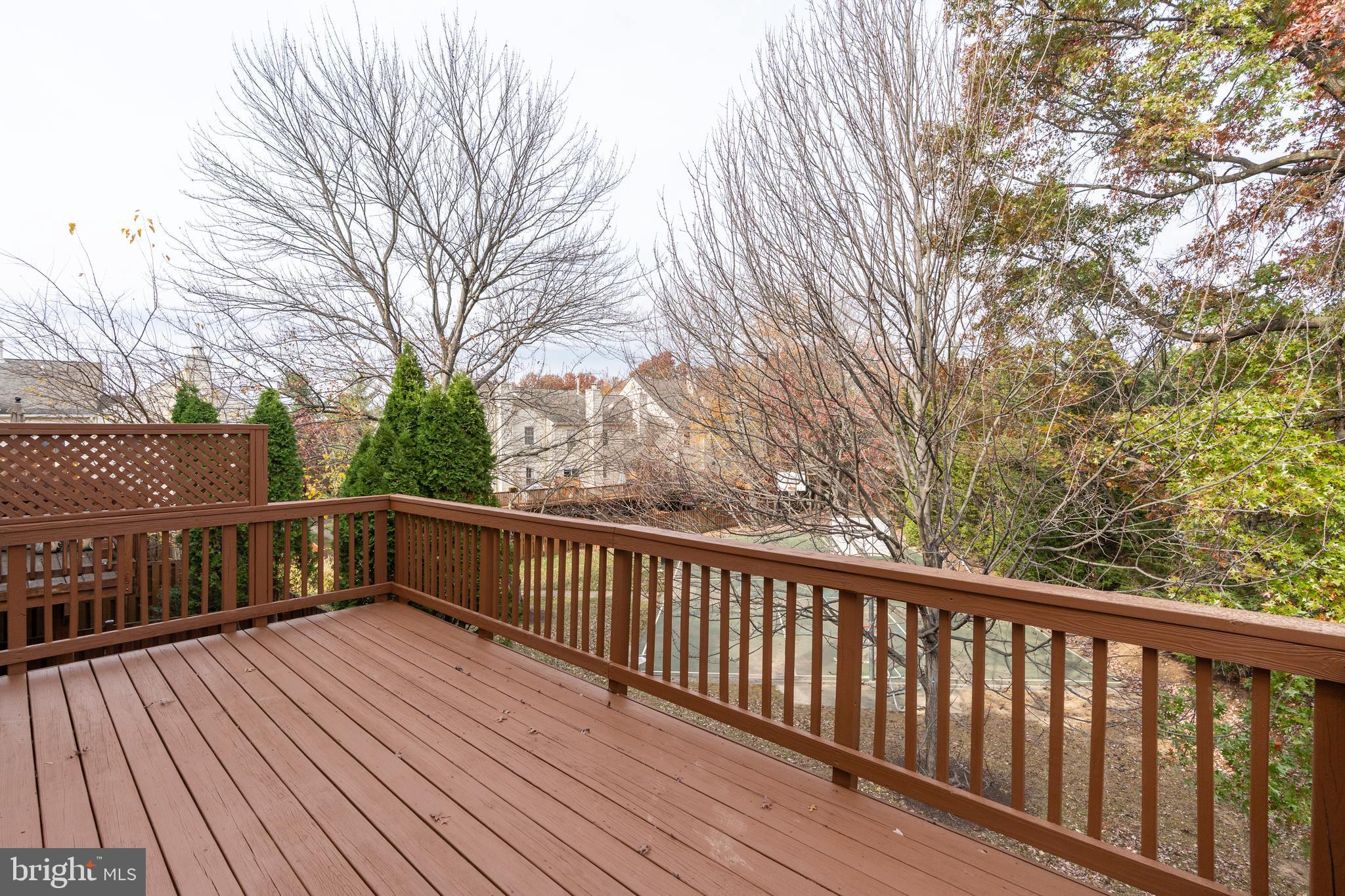 8010 Merry Oaks Lane Vienna, VA 22182 - Photo 14 of 33 a view of balcony with wooden floor and fence