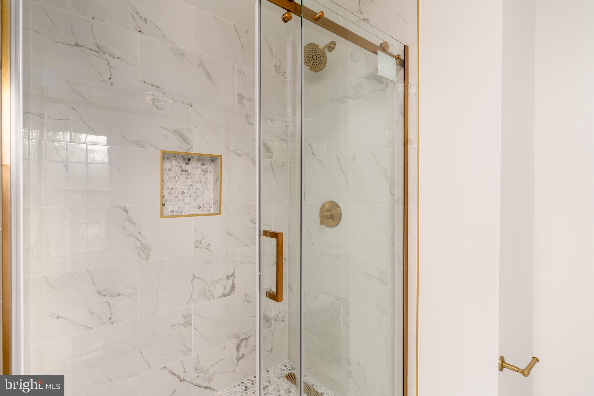 8010 Merry Oaks Lane Vienna, VA 22182 - Photo 17 of 33 a bathroom with a shower