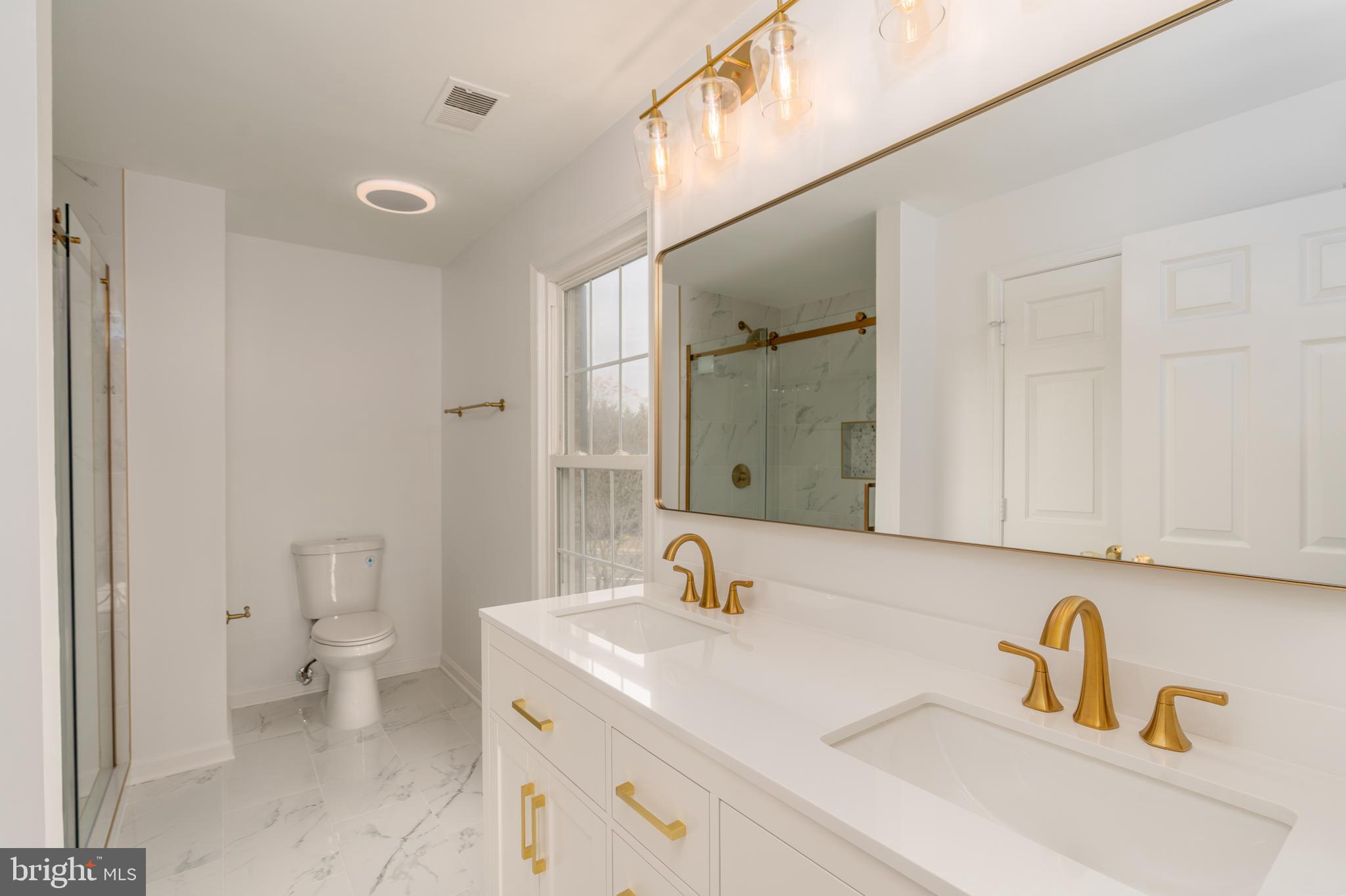 8010 Merry Oaks Lane Vienna, VA 22182 - Photo 18 of 33 a bathroom with a sink and a toilet