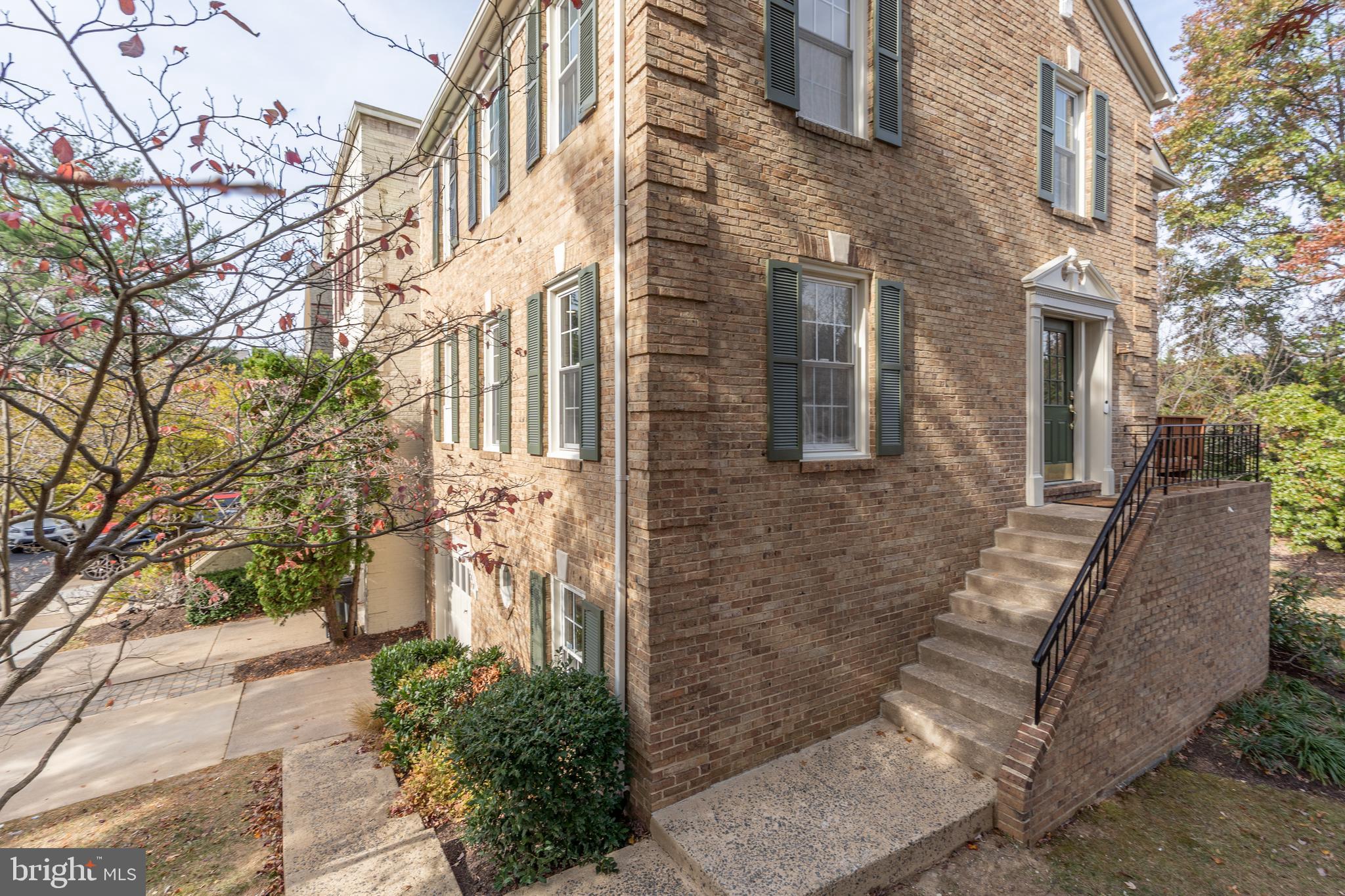 8010 Merry Oaks Lane Vienna, VA 22182 - Photo 2 of 33 a view of a brick buildings with many windows
