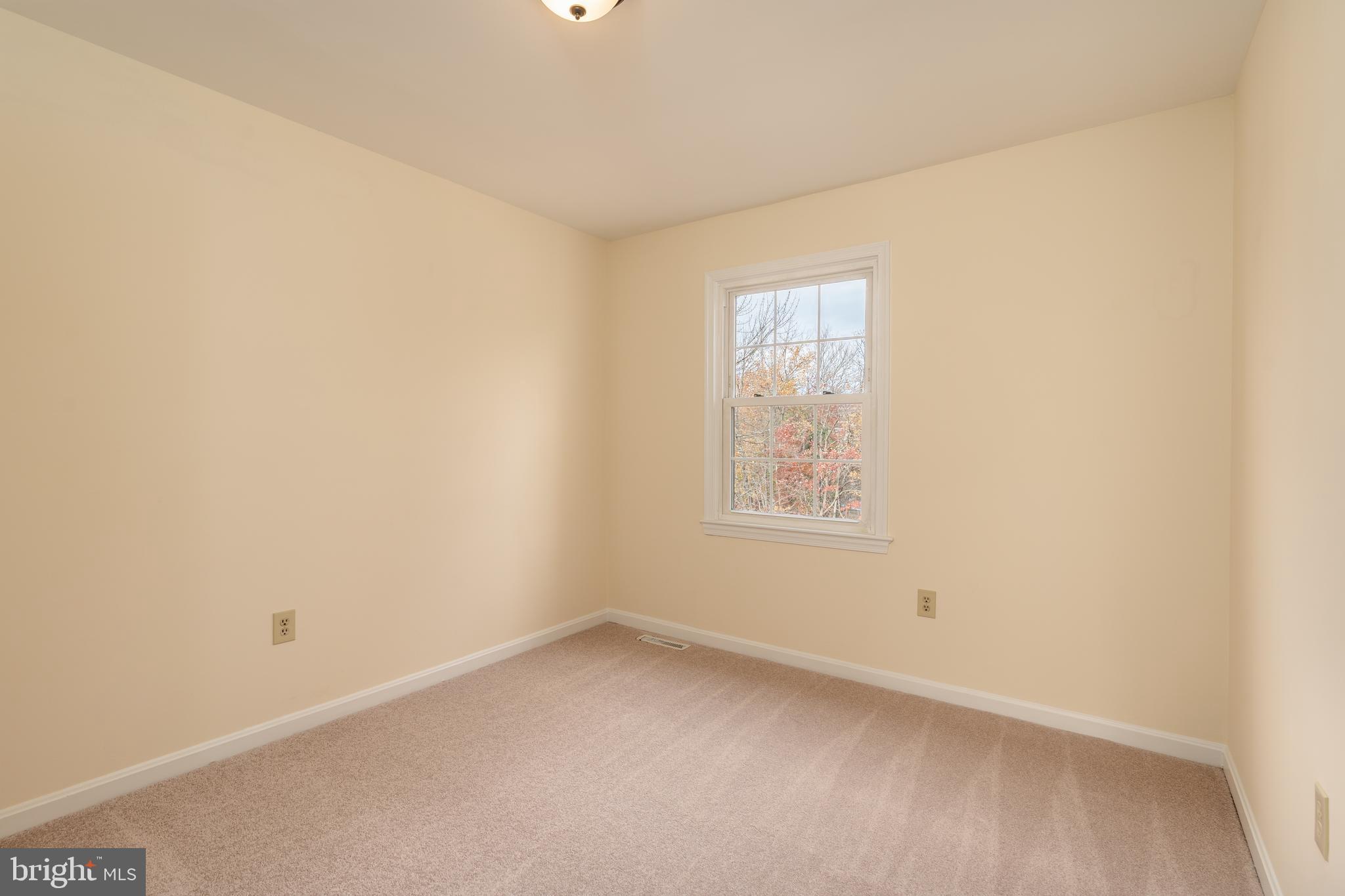 8010 Merry Oaks Lane Vienna, VA 22182 - Photo 25 of 33 an empty room with a window