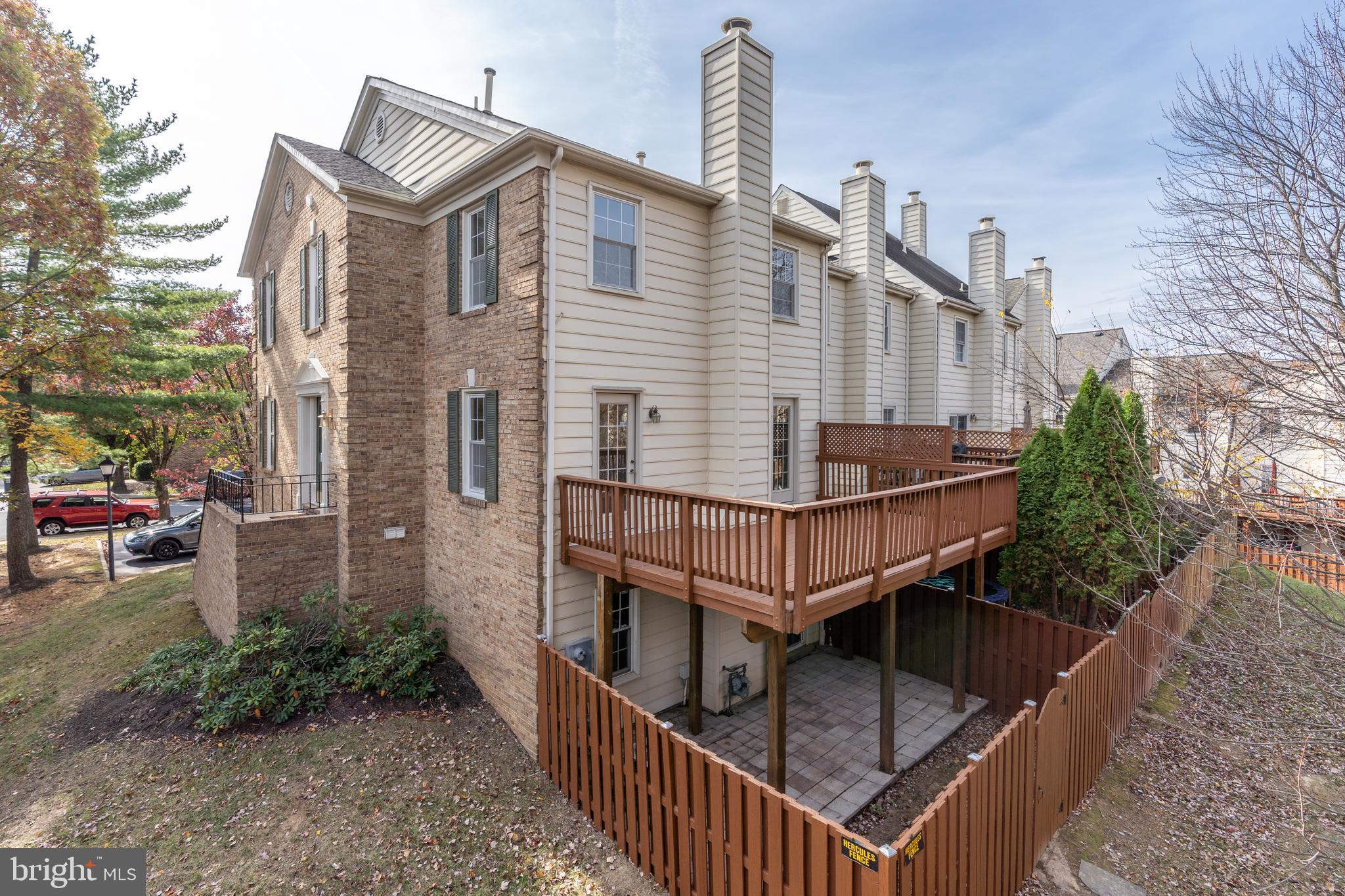 8010 Merry Oaks Lane Vienna, VA 22182 - Photo 30 of 33 a view of a house with backyard and deck