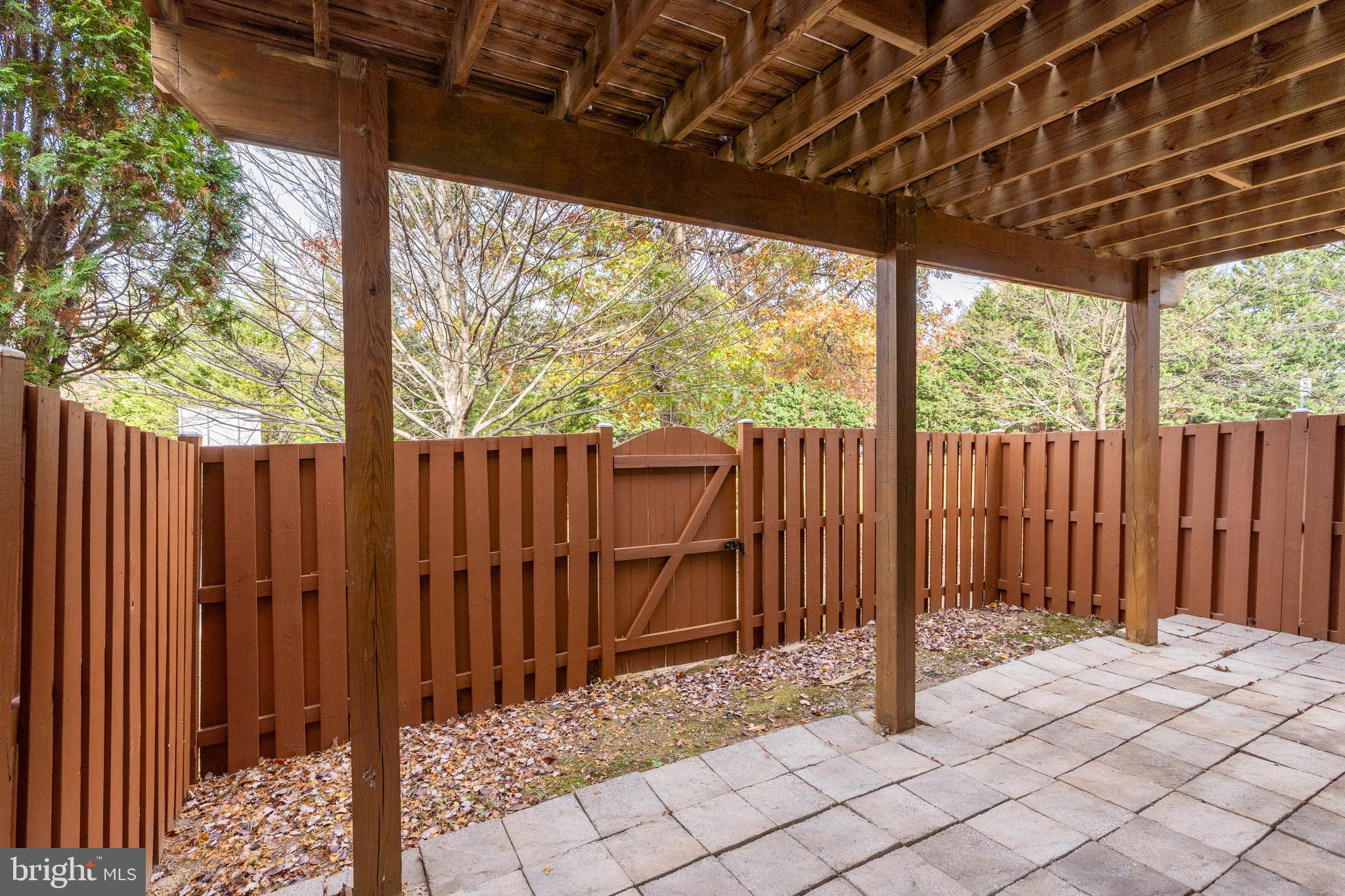 8010 Merry Oaks Lane Vienna, VA 22182 - Photo 31 of 33 a backyard of a house with table and chairs