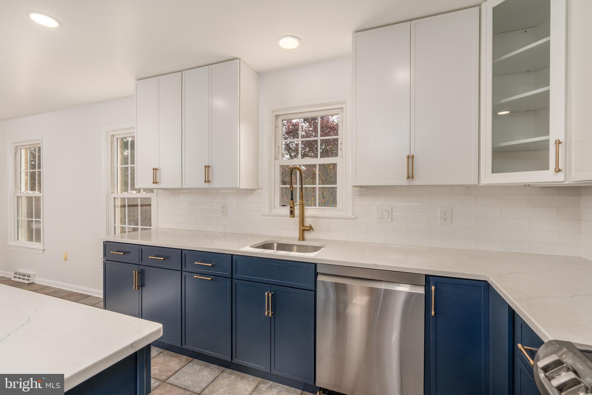 8010 Merry Oaks Lane Vienna, VA 22182 - Photo 5 of 33 a kitchen with a sink and cabinets