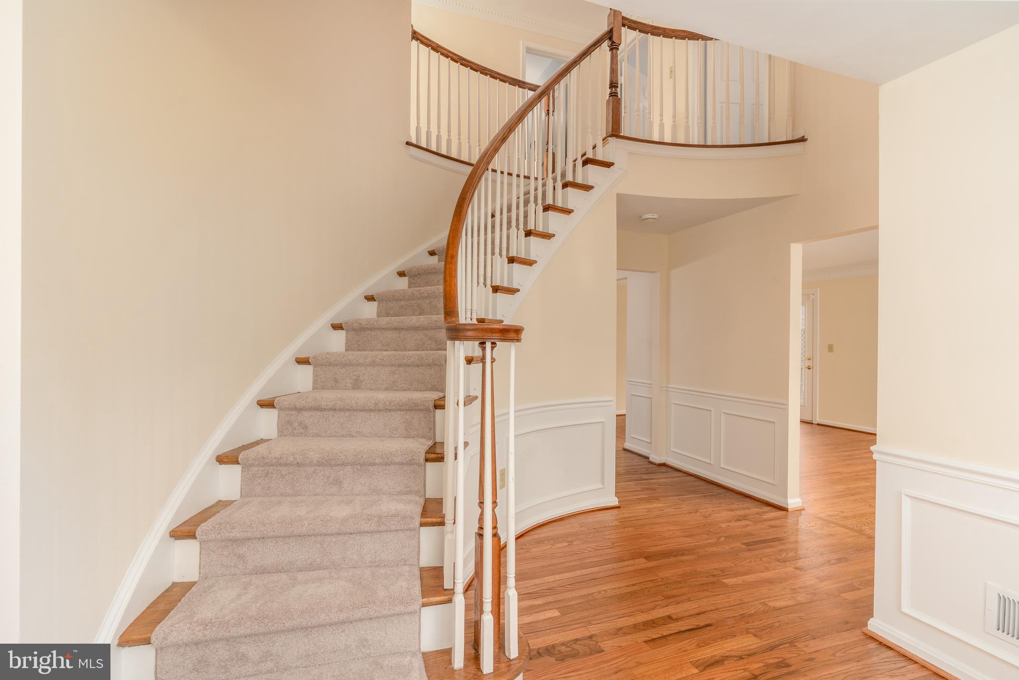 8010 Merry Oaks Lane Vienna, VA 22182 - Photo 7 of 33 a view of entryway and hall with wooden floor