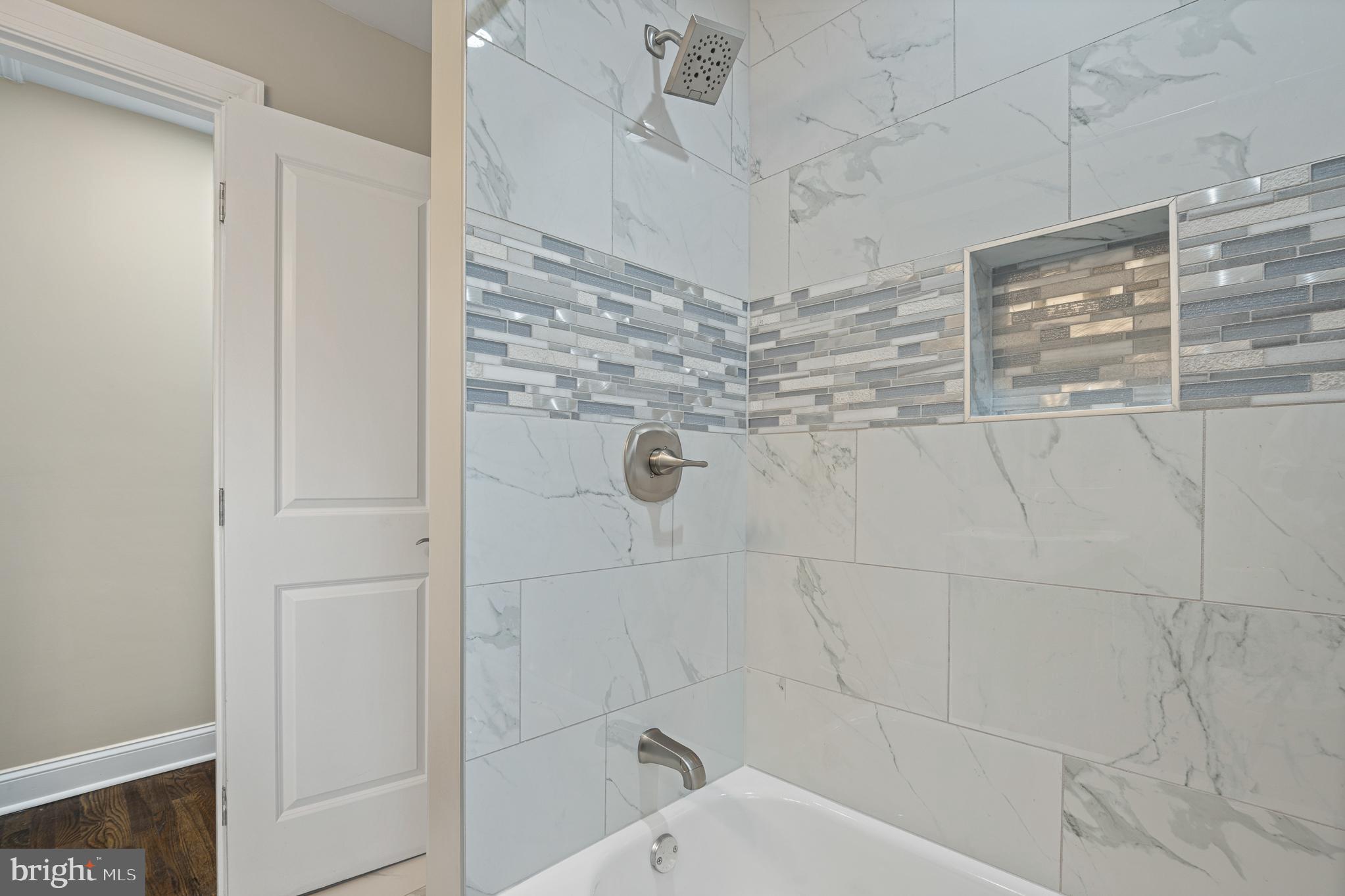 9217 Fowler Lane Lanham, MD 20706 - Photo 36 of 80 a bathroom with a shower