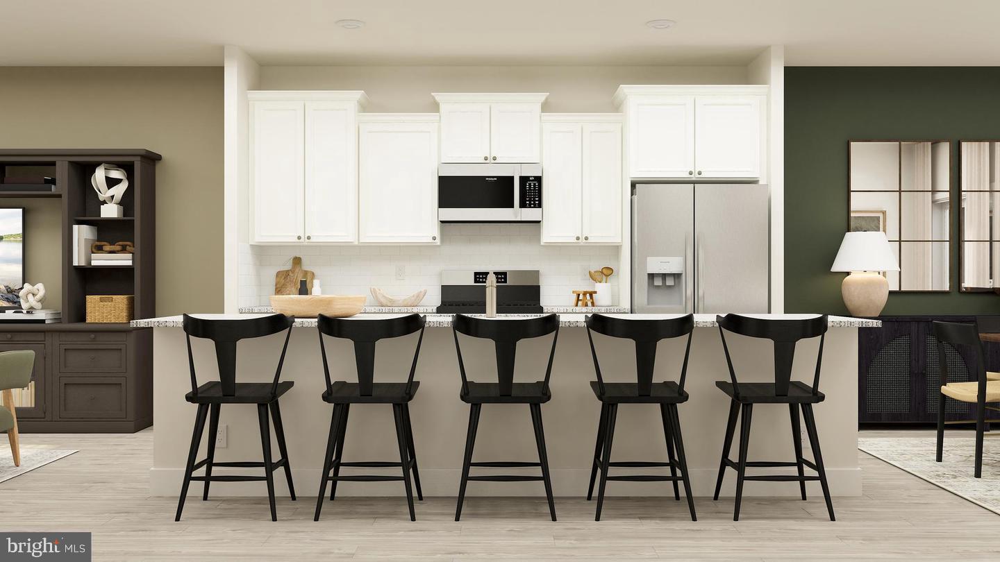 13945 Anderson Garden Road Laurel, MD 20707 - Photo 2 of 19 Modern kitchen with sleek bar seating.