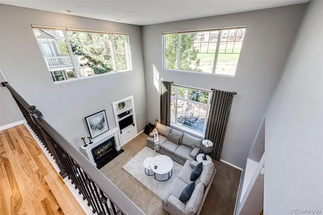 a kitchen with sink a refrigerator and cabinets
