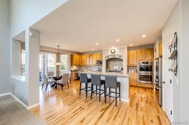 a view of a livingroom with workspace and a window