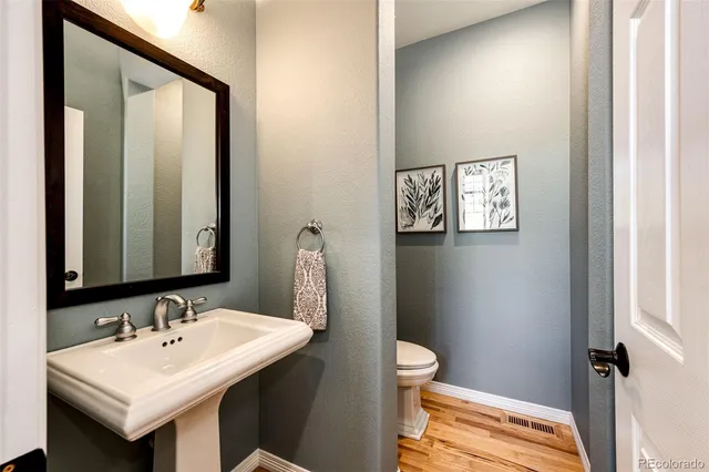 a spacious bedroom with a bed and a dresser