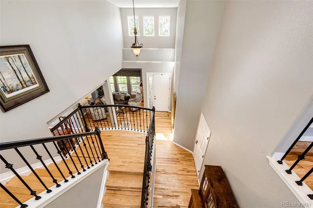 a view of a livingroom with workspace and a window