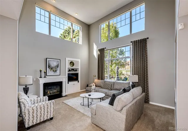 a dining hall with stainless steel appliances granite countertop a stove and refrigerator a dining table with wooden floor