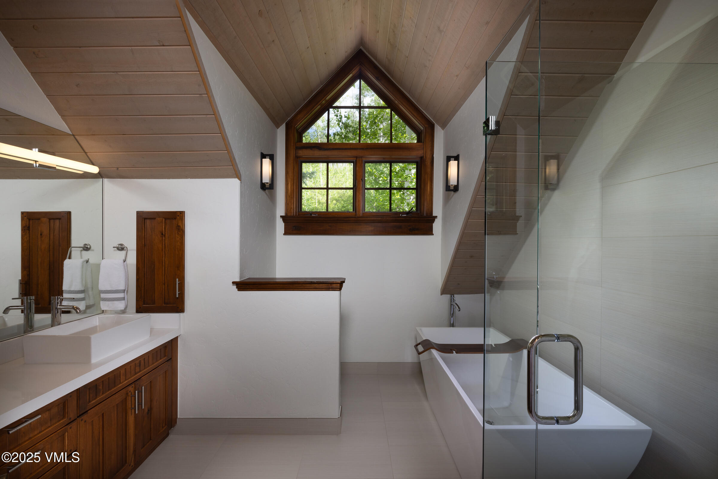 1761 Paintbrush Avon, CO 81620 - Photo 12 of 23 a bathroom with a bathtub sink and mirror