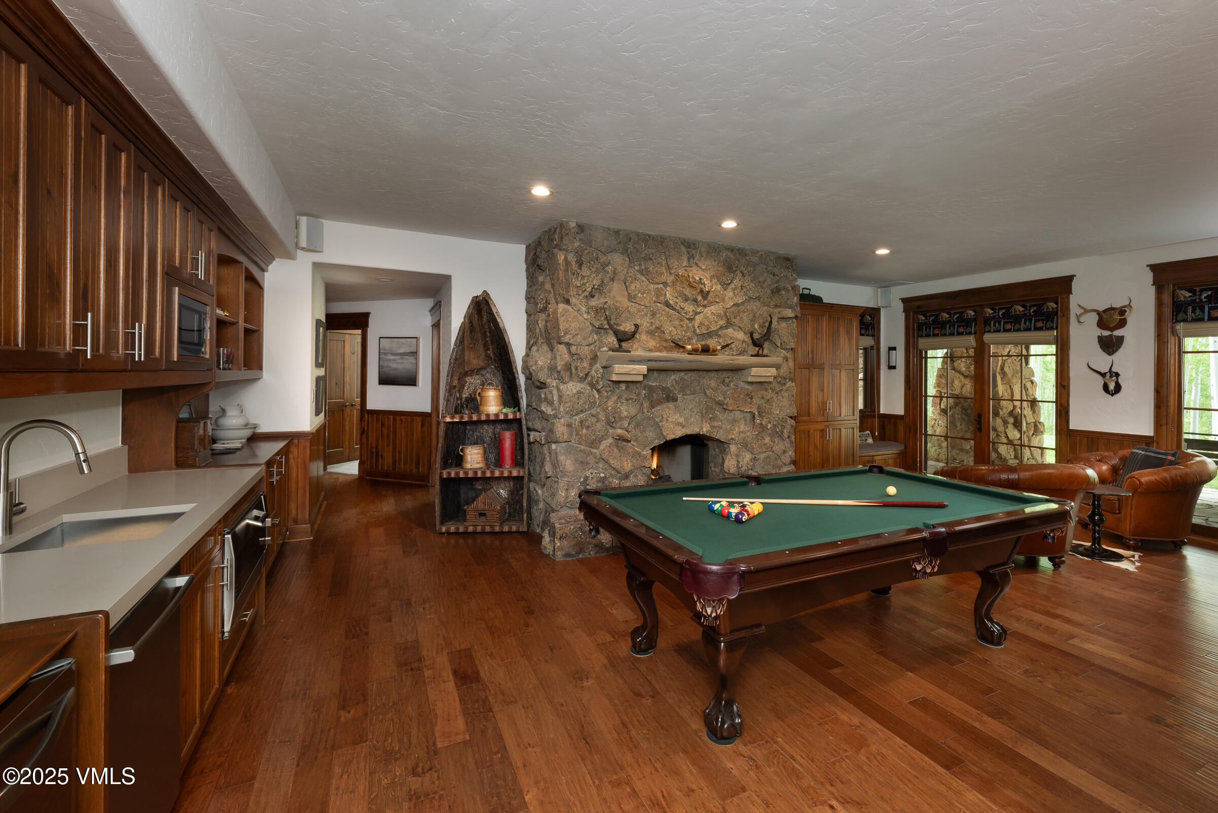 1761 Paintbrush Avon, CO 81620 - Photo 14 of 23 a room with furniture pool table wooden floor and windows