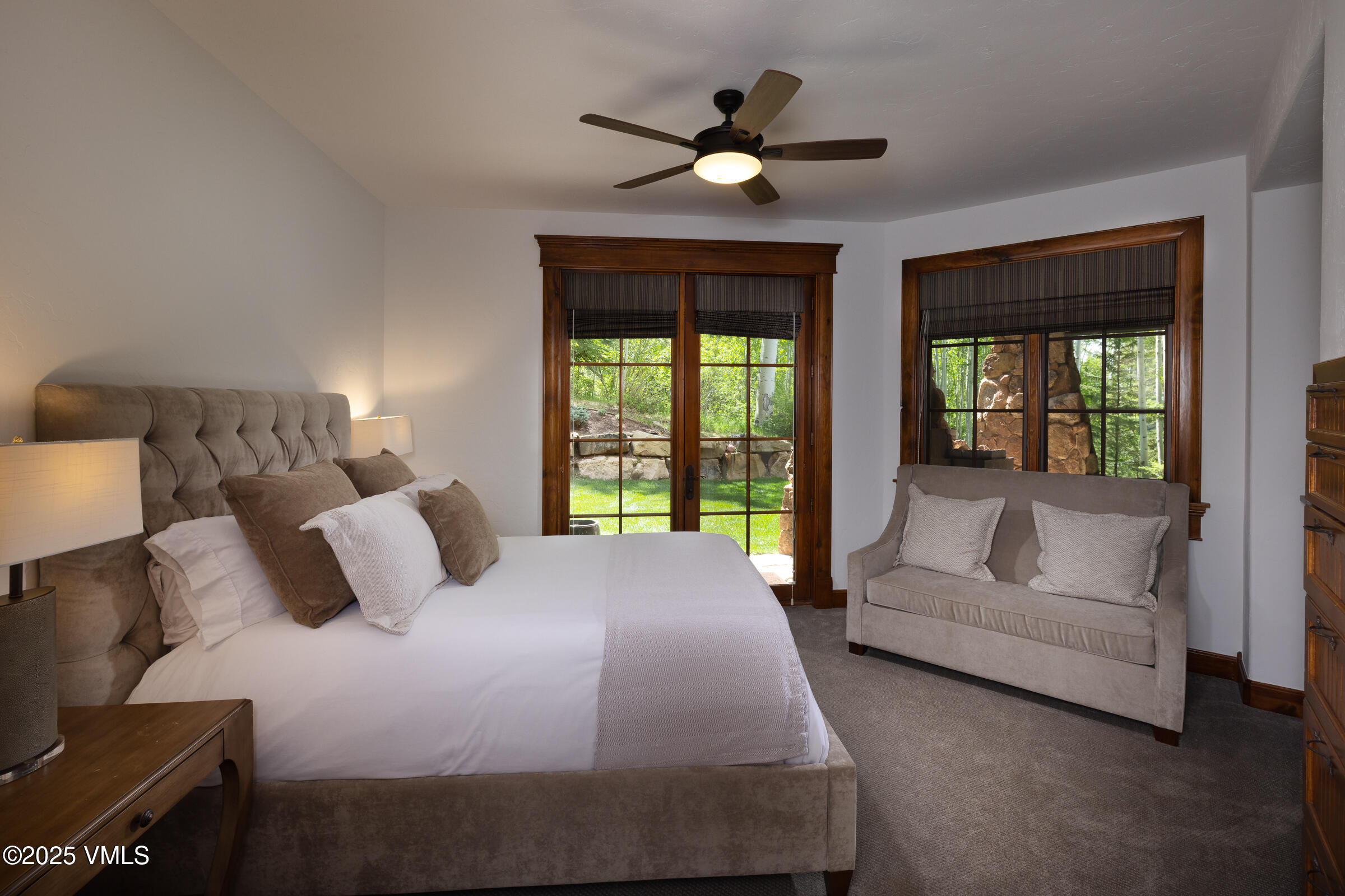 1761 Paintbrush Avon, CO 81620 - Photo 16 of 23 a bedroom with a large bed couch and a large window