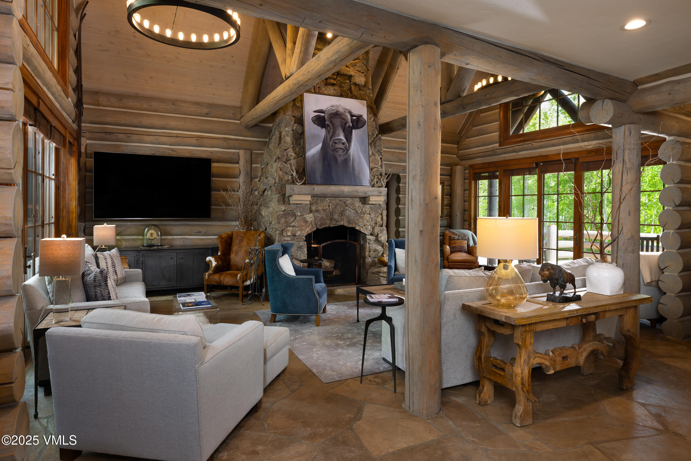 1761 Paintbrush Avon, CO 81620 - Photo 2 of 23 a living room with furniture a fireplace and a flat screen tv