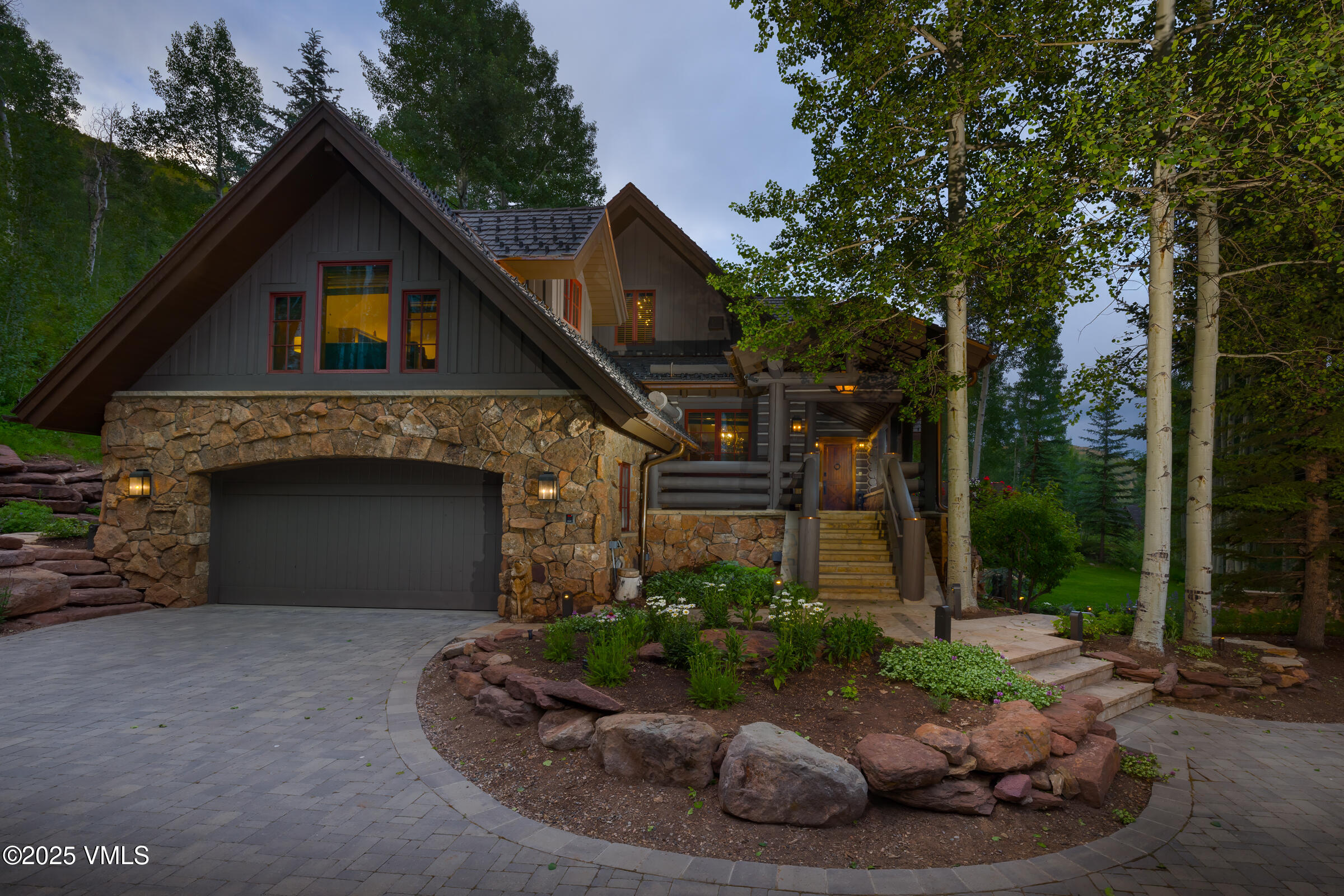 1761 Paintbrush Avon, CO 81620 - Photo 21 of 23 a front view of a house with a yard and garage