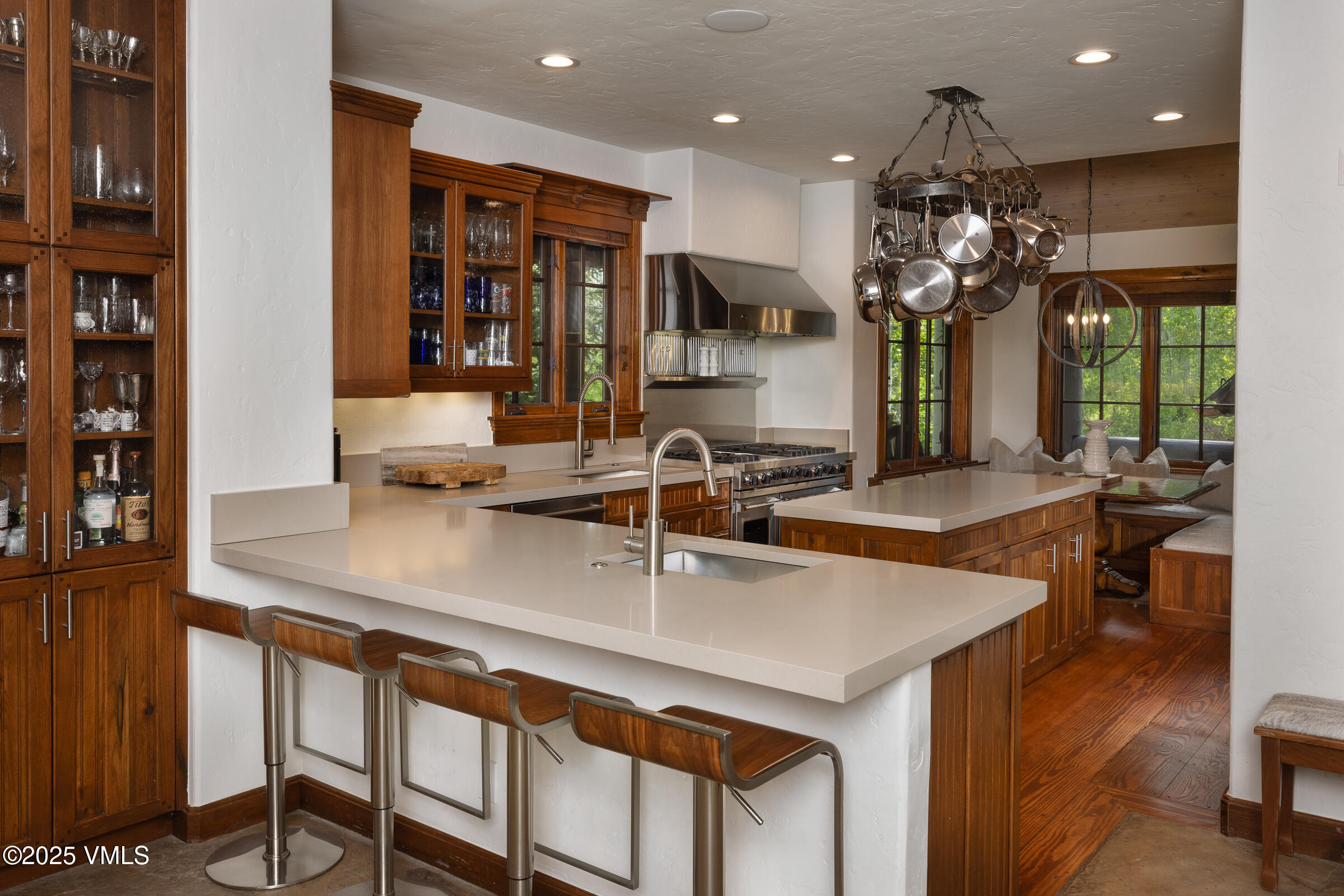 1761 Paintbrush Avon, CO 81620 - Photo 6 of 23 a kitchen with a table chairs and living room