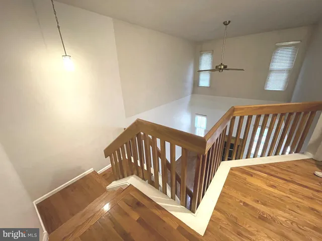 a view of staircase with white walls