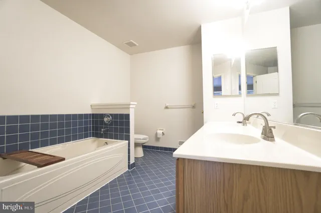 a bathroom with a bathtub a sink and a toilet