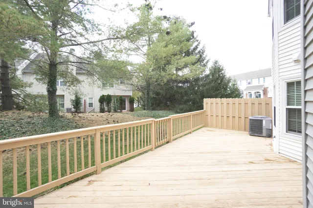 a view of a wooden deck and city view