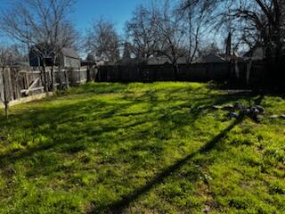 1785 Brigman Street Anderson, CA 96007 - Photo 12 of 13 a view of a backyard with large trees